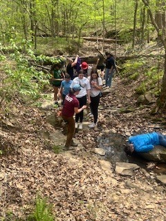 students learning on their hike