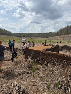 students explore an old house foundation in the old lake bed