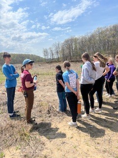 students learning on their hike