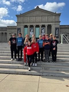 Student council members in front of the museum of science and technology