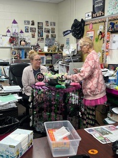 Ms Beth takes around pink and green goodies to the teachers
