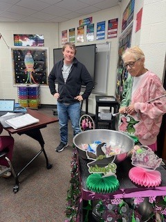 Ms Beth takes around pink and green goodies to the teachers