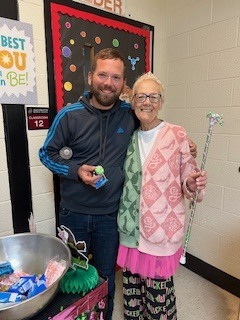 Ms Beth takes around pink and green goodies to the teachers
