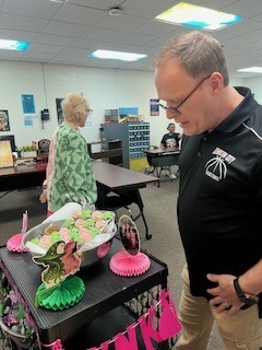 Ms Beth takes around pink and green goodies to the teachers