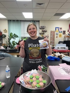 Ms Beth takes around pink and green goodies to the teachers