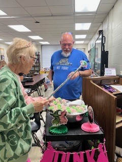 Ms Beth takes around pink and green goodies to the teachers