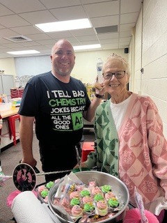 Ms Beth takes around pink and green goodies to the teachers