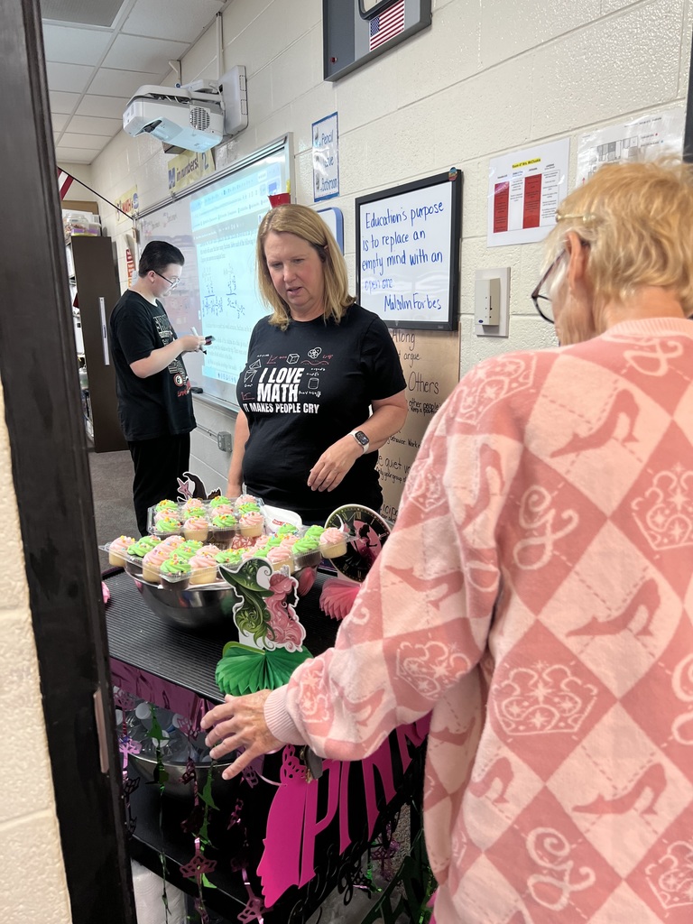 Ms Beth takes around pink and green goodies to the teachers