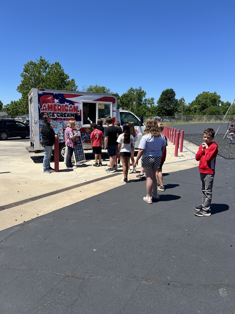 students stand in line to visit the ice cream truck