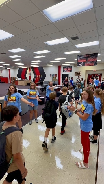 WEB leaders guide 5th grade students on their first day