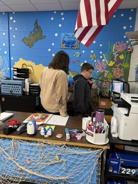 students helping with morning announcements