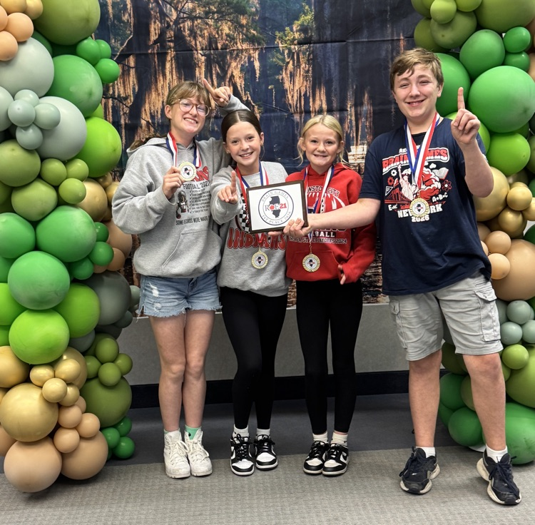 6th grade brain games participants pose with their first place award