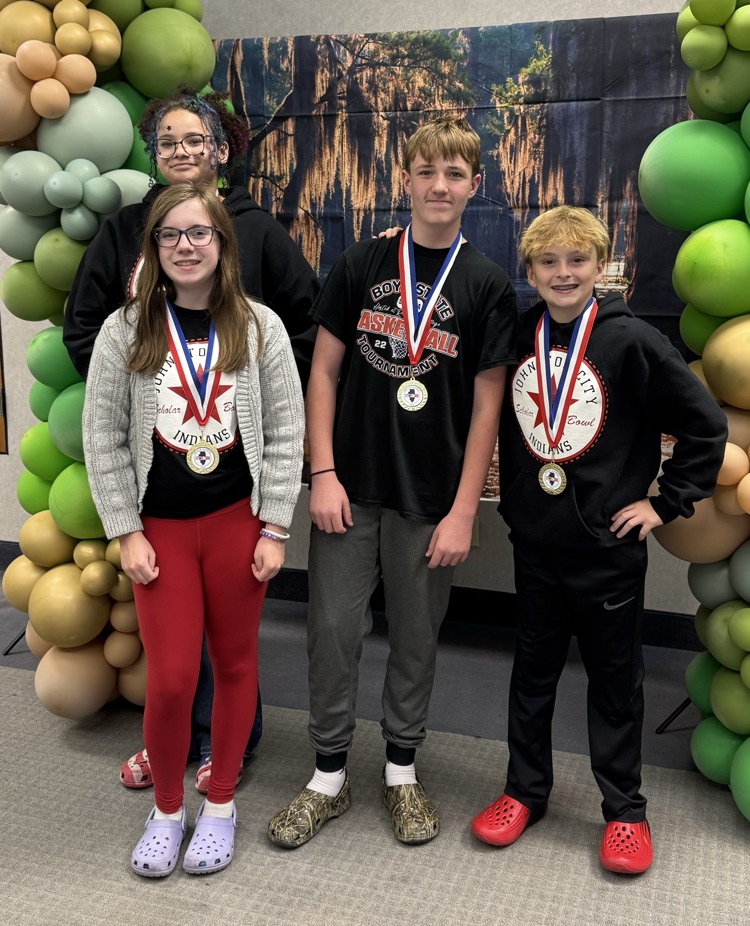 7th grade brain games participants pose with their awards