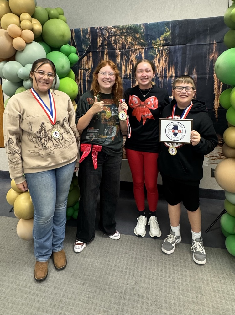 8th grade brain games participants pose with their awards