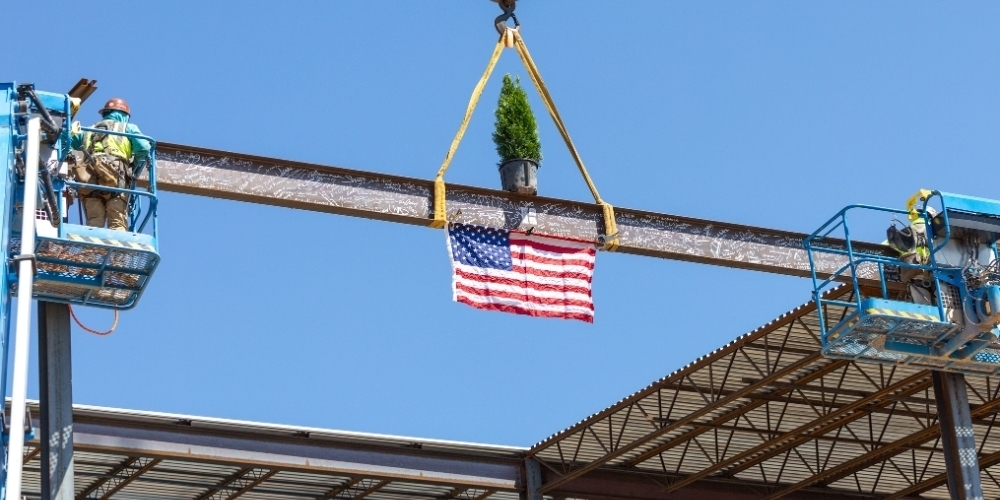 The final beam for Wilson's Mills High is put in place.