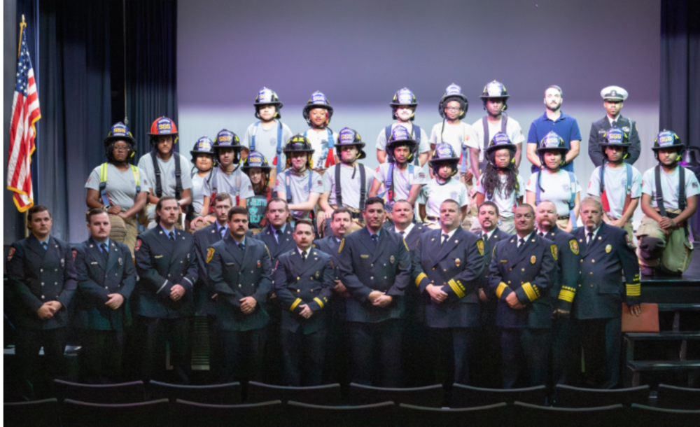 First responders standing on auditorium stage