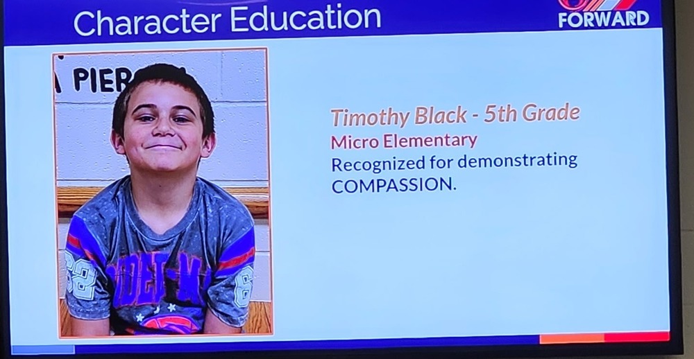 Photo of slide show honoring 5th grade Timothy for demonstrating compassion