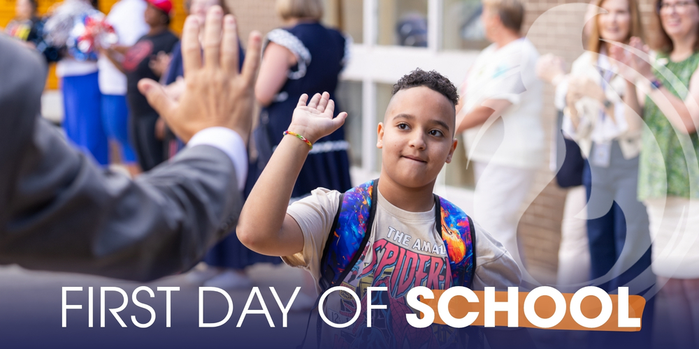 student high fives superintendent as he walks into school on the first day of school for the 2026-2027 school year