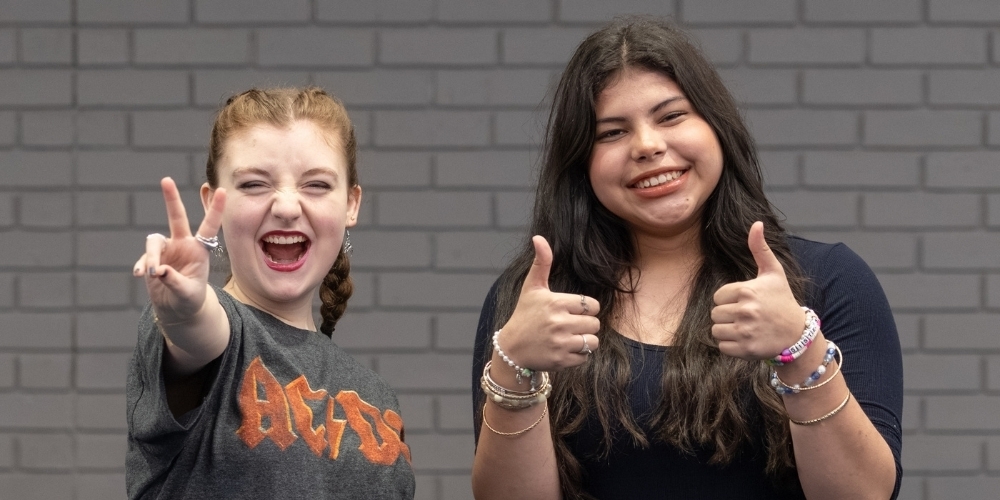 two students smiling