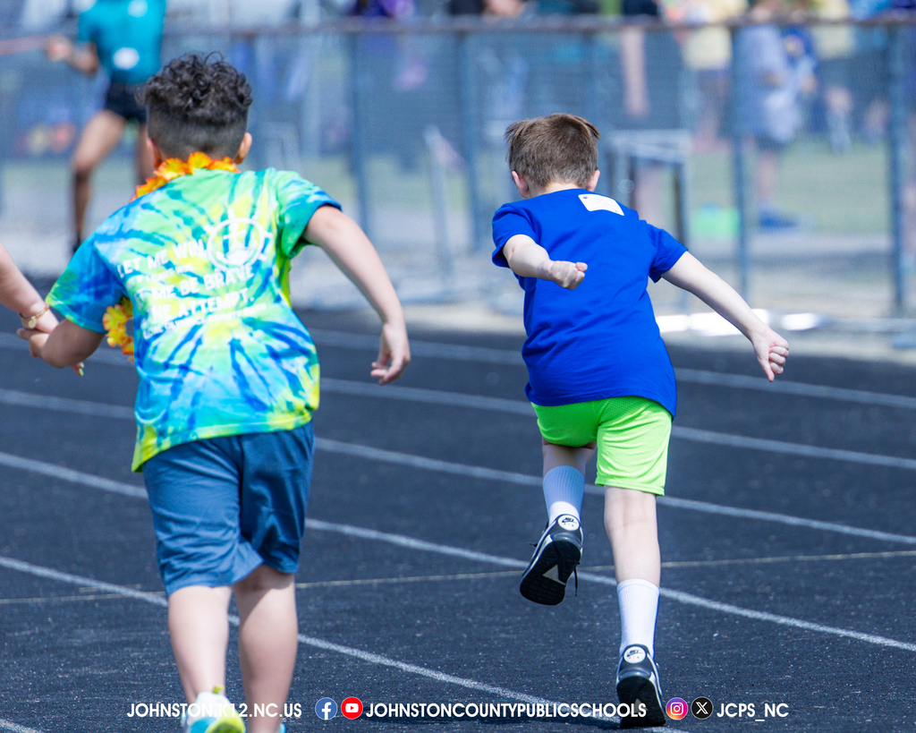 Two students run in an event.