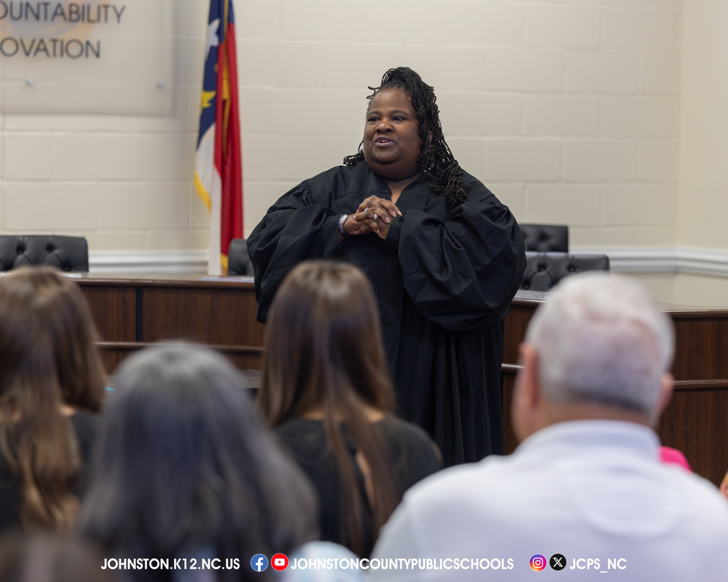 Judge speaking to audience