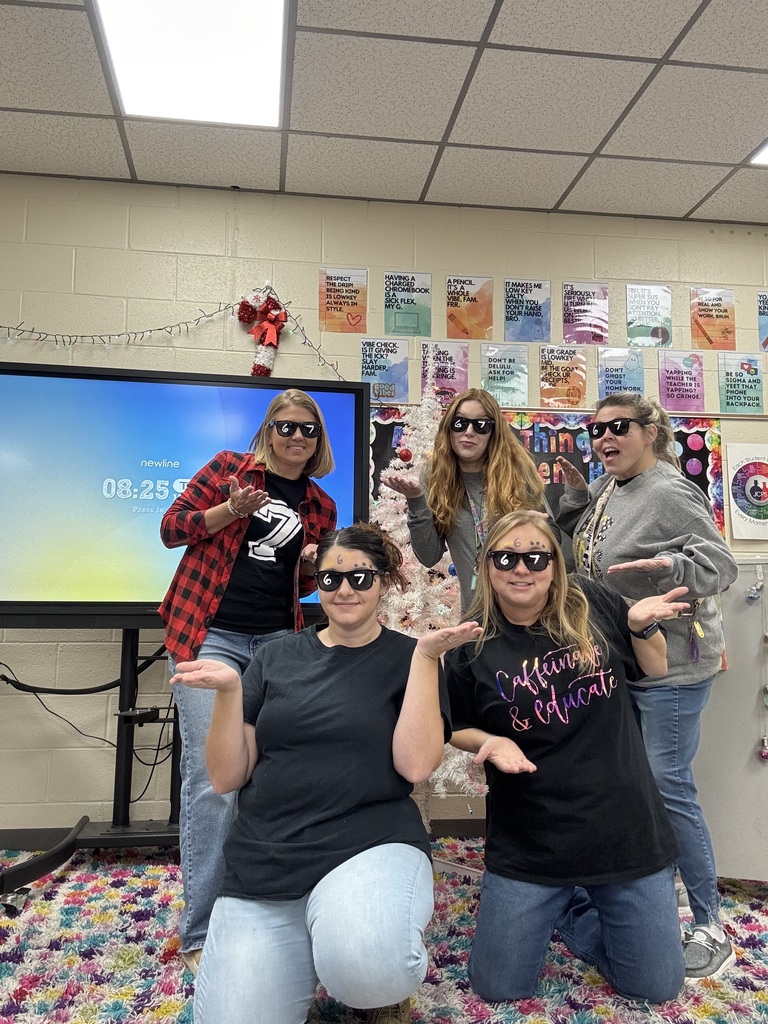 Group of teachers wearing glasses with 6 and 7 on the lens for 67 day