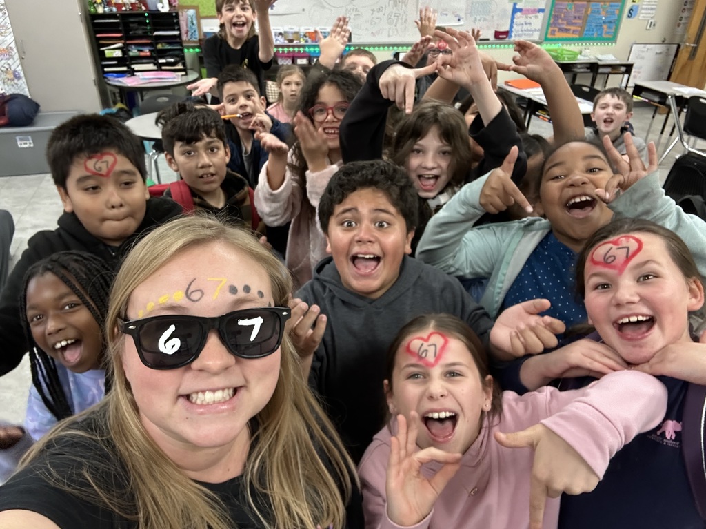 Class photo with teacher celebrating 67 day