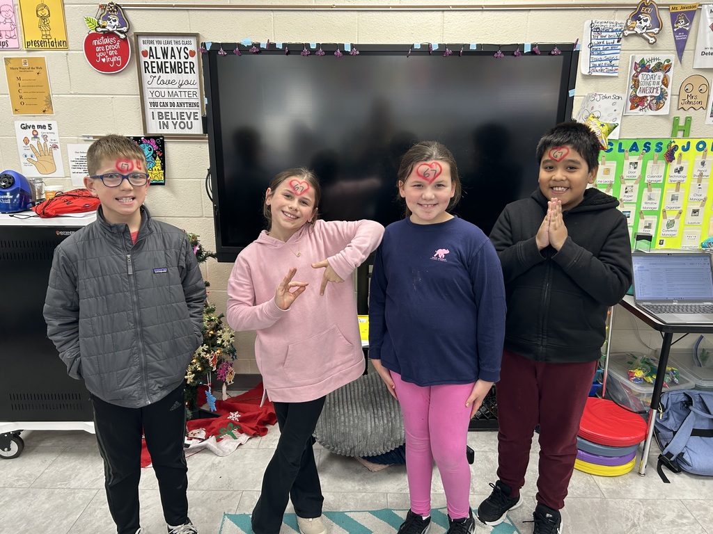 Group of first graders in front of smart board