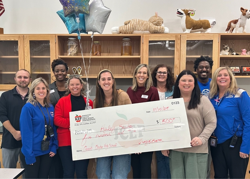 Haley Sauls receives grant check