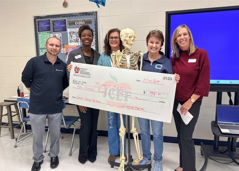 Stephanie Beasley receives grant check