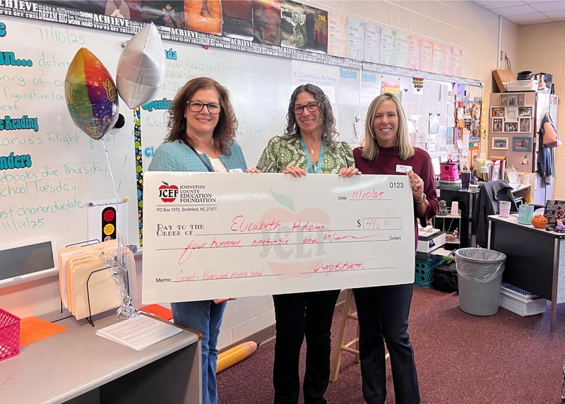 Elizabeth Adams receives grant check