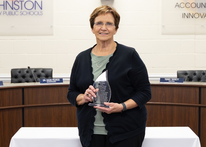 Debra Avery stands with her Living Legend Awawrd.