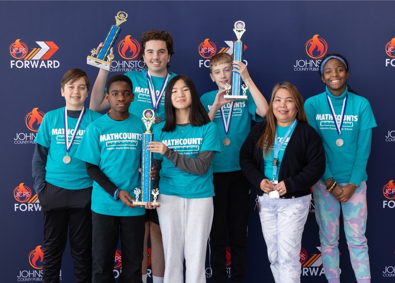 The Cleveland Middle MATHCOUNTS team poses for a photo for their first place trophy.