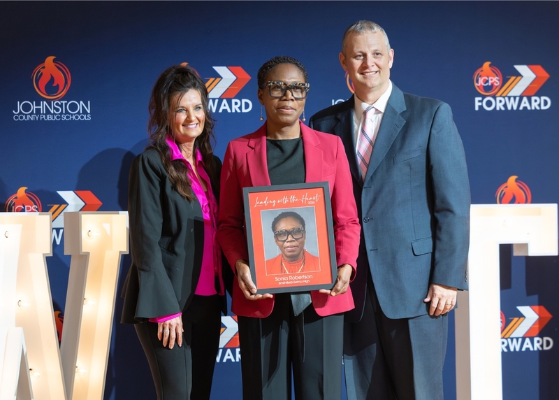 Sonia Robertson stands in between Patty Whittington and Dr. David Pearce.