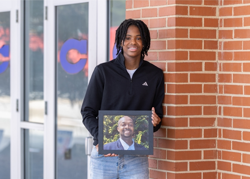 Y'Zana Lee Randle holds a picture of her father Marlon Lee