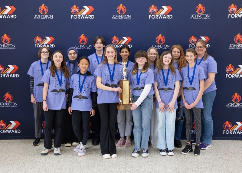Swift Creek middle team holds the first place Battle of the Books trophy