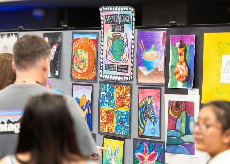 Concert-goers take time to admire the outstanding artwork by exceptionally talented JCPS students from all grade levels.