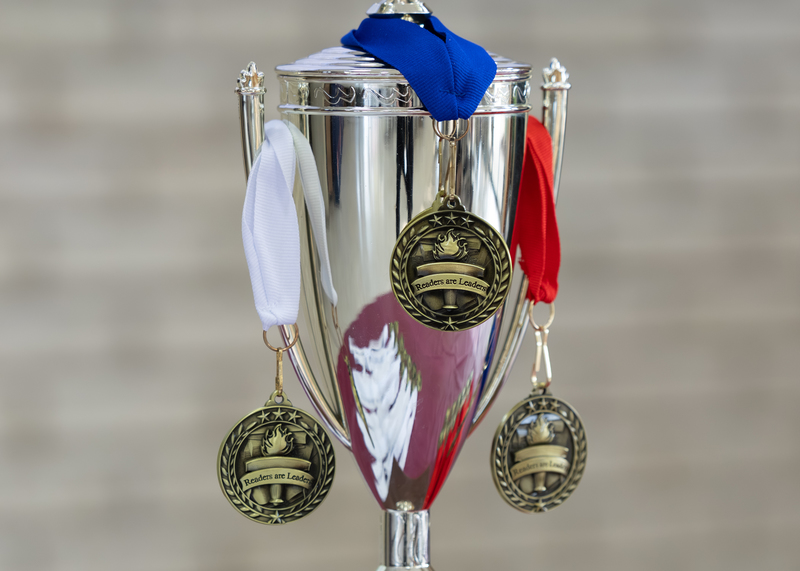 Medals adorn the first place high school Battle of the Books trophy.