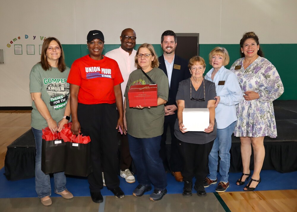 School board members congratulate employees who have worked 30, 35, and 40 years in the school district