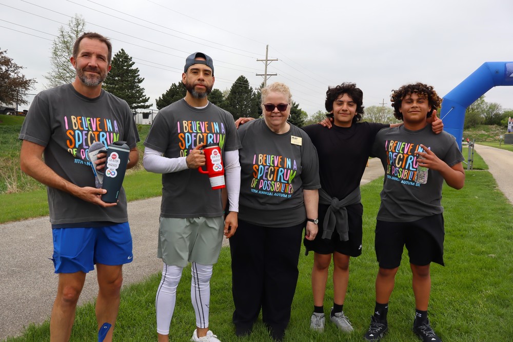 School Superintendent with four Autism 5K Run Winners
