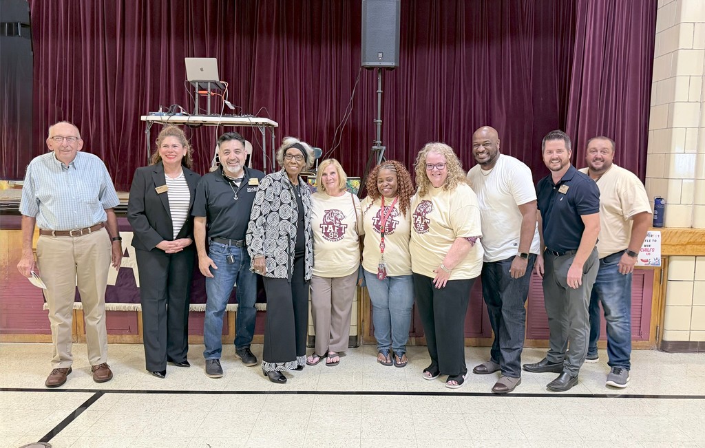 Picture of school board, superintendent, and current and former Taft administrators at 95th Anniversary Event.