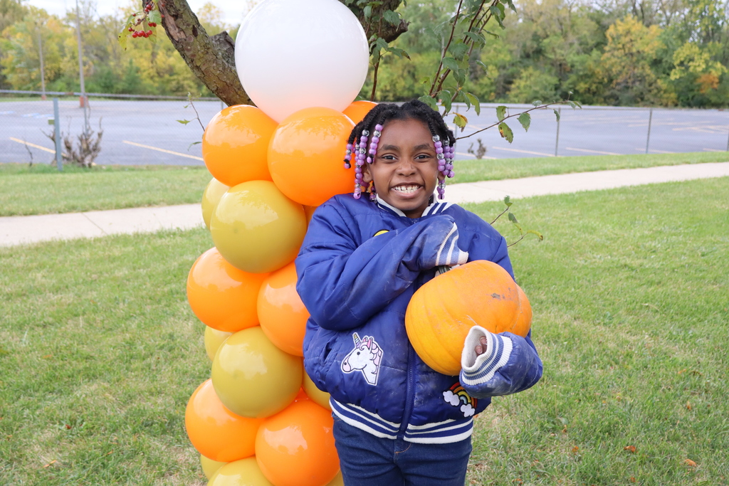 Picture of student with pumpkin