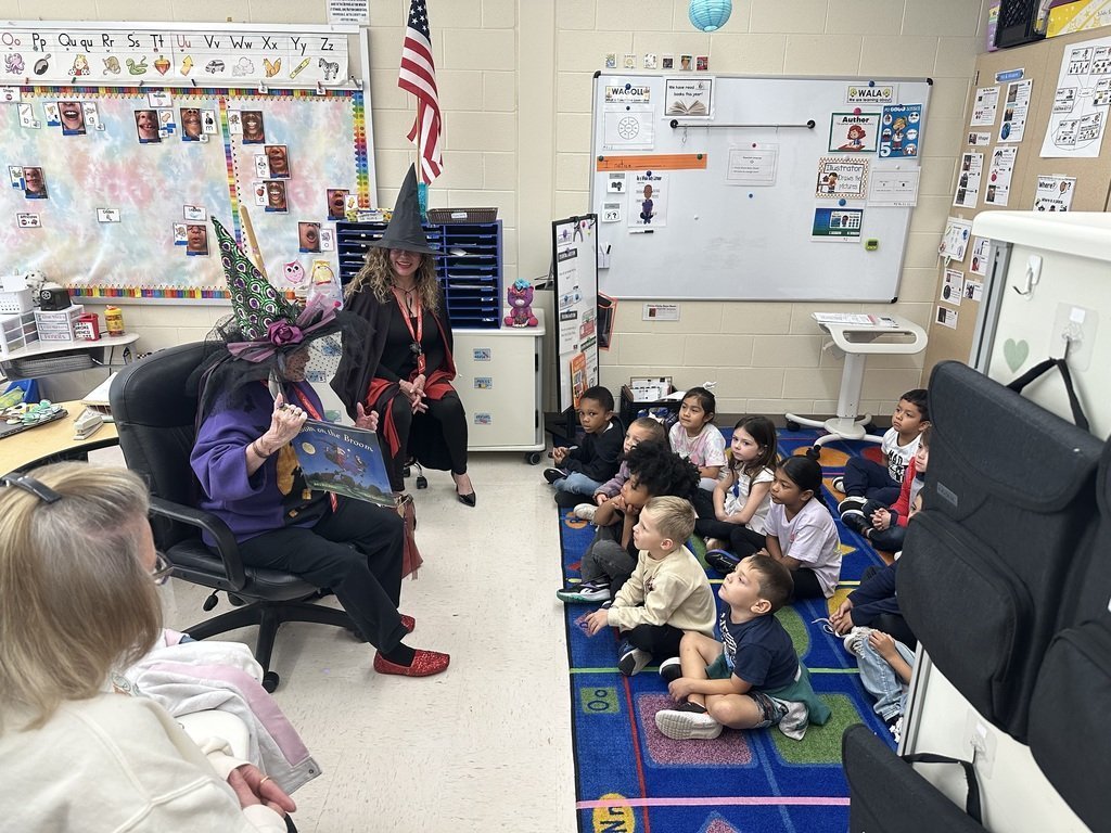 School Board Members read Halloween book to students