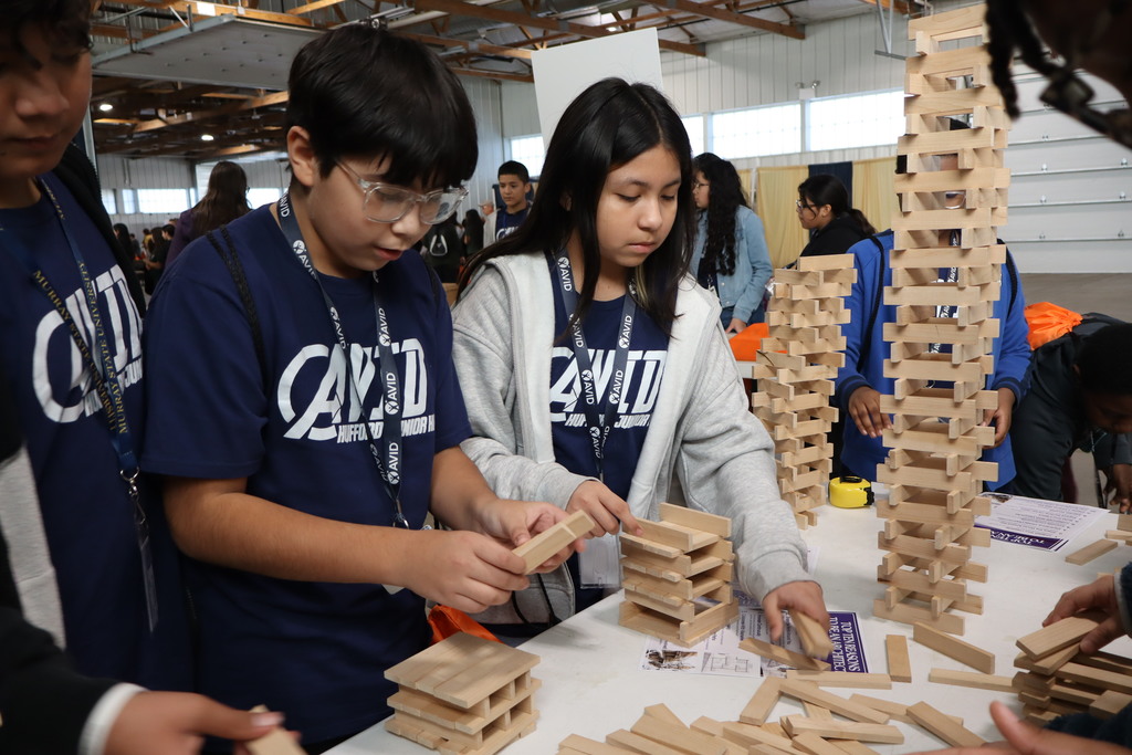 Junior High Students building a tower with blocks at STEAM Fair