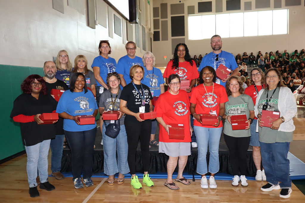 Group picture of staff celebrating 25 years in the school district