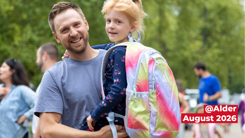 student with parent smiling