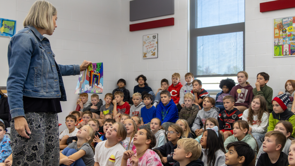 Melisa Hayes reading her book ABBS to students