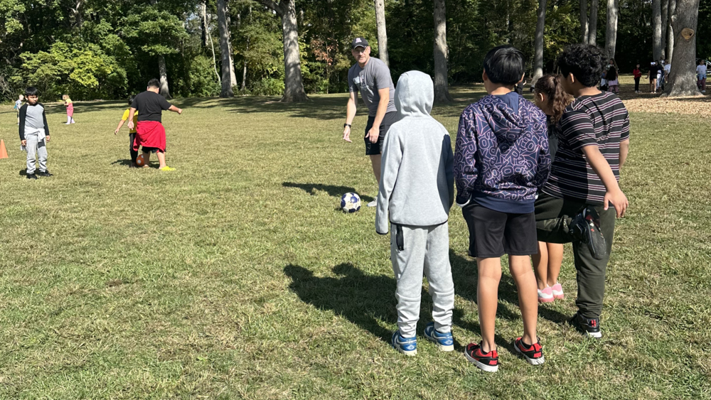 MES students learning soccer