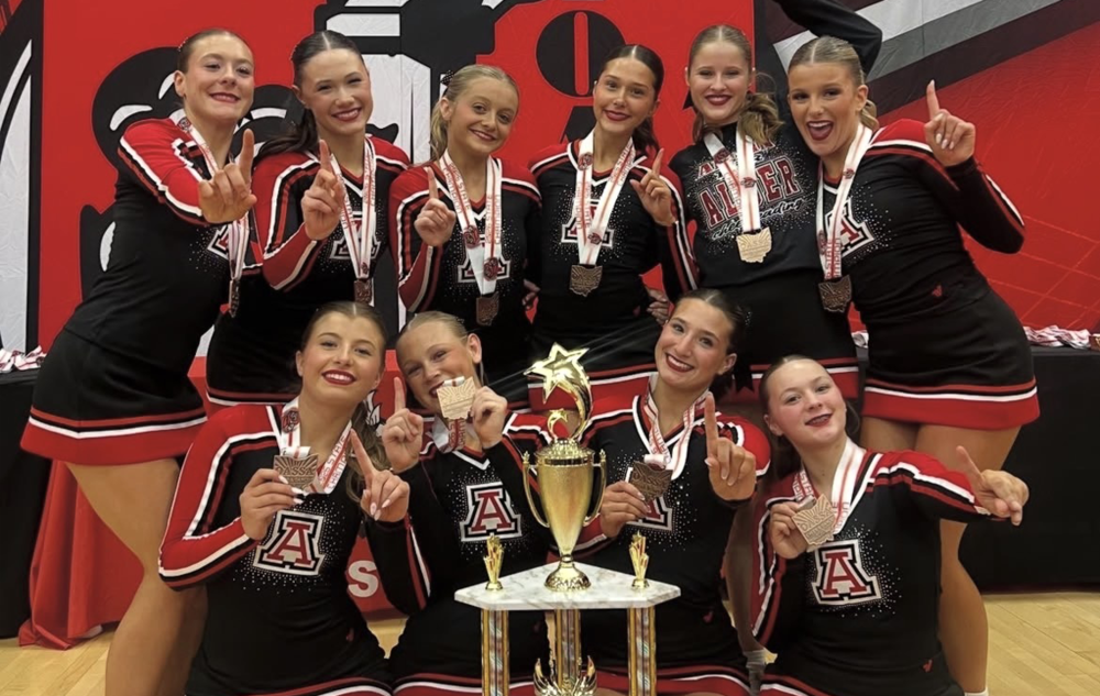 JAHS cheer team with trophy