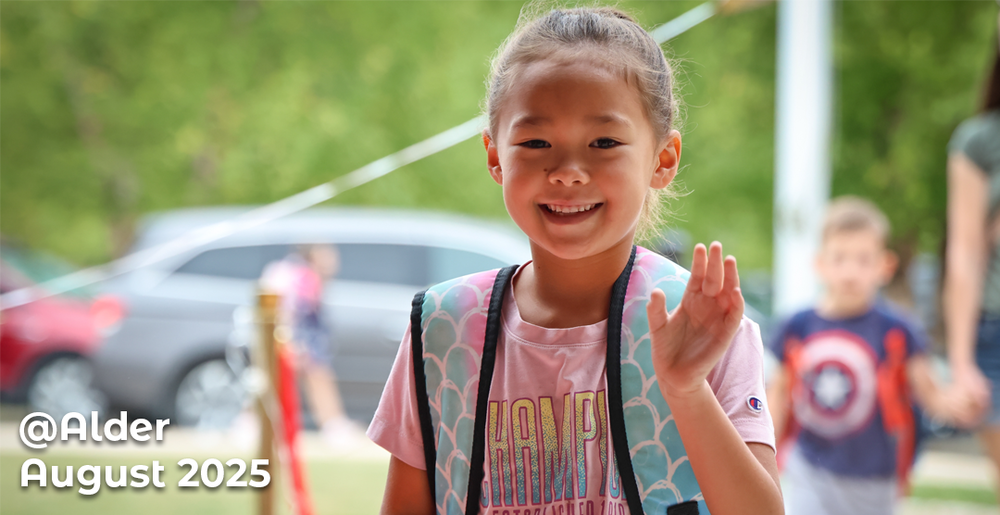 student waving